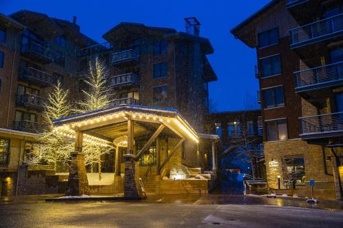 a gazebo with lights in front of a building at Hotel Terra Jackson Hole, a Noble House Resort in Teton Village