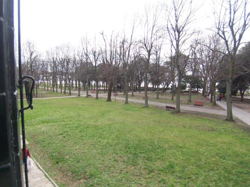 a view of a park with trees and grass at Bella Vista Apartment in Venice