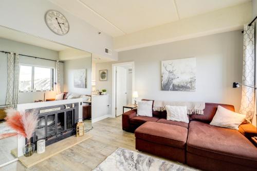 a living room with a couch and a fireplace at Pool Access and Mtn Views Cozy Sugar Mtn Escape in Sugar Mountain