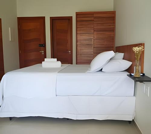Ένα ή περισσότερα κρεβάτια σε δωμάτιο στο Residencial Mirante