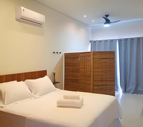 Ένα ή περισσότερα κρεβάτια σε δωμάτιο στο Residencial Mirante