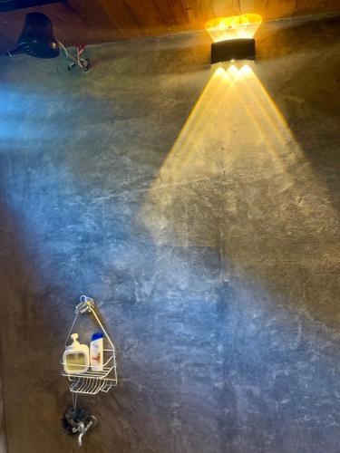 a shopping cart with a light on the floor at Chalet de los ciervos in Isla Cabuya