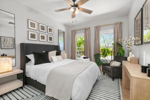 a bedroom with a bed and a ceiling fan at LUXE, Breathtaking Mountain Views, Hot Tub, Fire Pit, Fire Pit Table, Pool Table, 2 Living rooms, Universal EV Station in Hendersonville