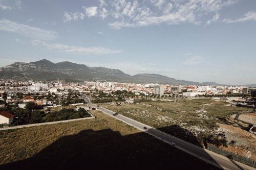 a view of a city with cars on a road at Helia Luxury Apartment New Boulevard in Tirana
