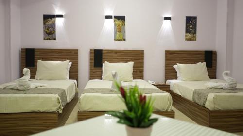 Postel nebo postele na pokoji v ubytování Good Season Hotel