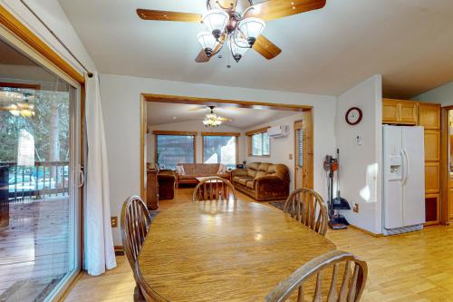 a dining room with a wooden table and chairs at Whaleshead Grove in Carpenterville