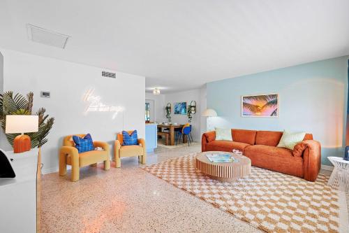 a living room with a couch and two chairs at Private Pool 6 MI to Clearwater Beach Fire Pit Game Room in Clearwater