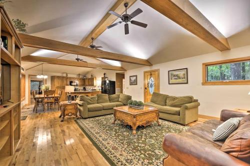 a living room with couches and a table at The Oakwood house in Rising Fawn