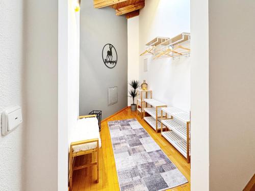 a room with white walls and wooden floors at !GoldPath! Loft - Exclusiv - XXL - Central - Sauna - Tiefgarage - Cozy in Waldkirchen
