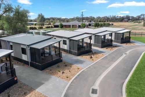 a row of modular homes in a park at Discovery Parks - Echuca in Echuca