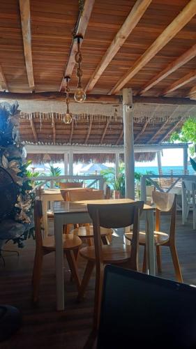 a dining room with tables and chairs in a restaurant at Cristal Blue Barú in Baru