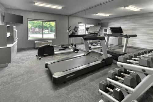 a fitness room with a treadmill and a laptop on a desk at Fairfield Inn & Suites by Marriott Frankenmuth in Frankenmuth