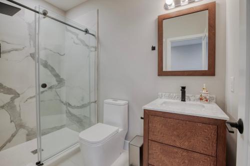 a bathroom with a shower and a toilet and a sink at One Sky Loft in Philadelphia