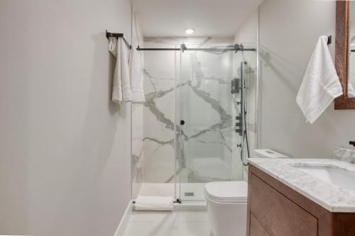 a bathroom with a shower and a toilet at One Sky Loft in Philadelphia