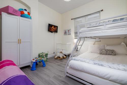 a kids bedroom with a bunk bed and a bunk bed at Music Lovers Paradise 7 Bed Pool Home and Game Room in Indio