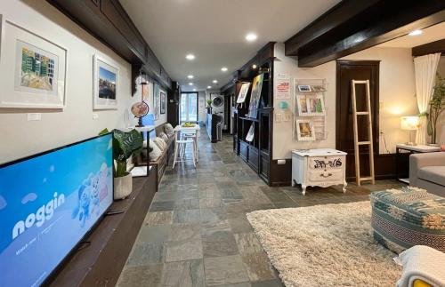 a living room with a couch and a tv in a trailer at Artist's apartment in the heart of the city in Sacramento