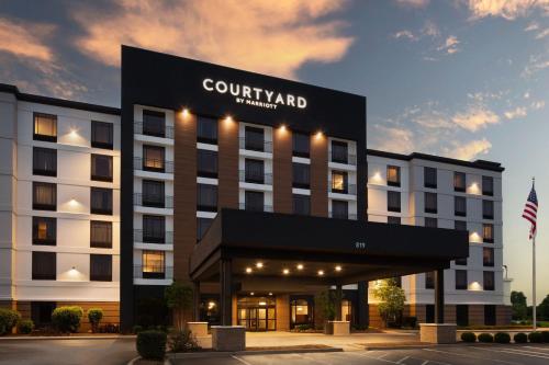 a rendering of a hotel with a building at Courtyard Louisville Airport in Louisville