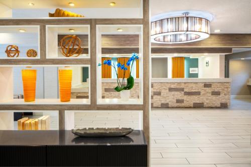 a kitchen with vases on shelves and a counter at Residence Inn Orlando Convention Center in Orlando