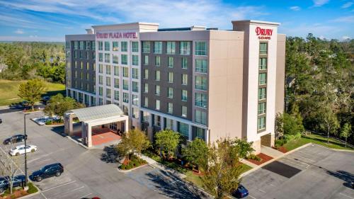 an aerial view of a hotel building with a parking lot at Drury Plaza Hotel Valdosta in Valdosta