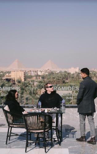 a group of people sitting at a table at Pyramids Sunshine View in Cairo