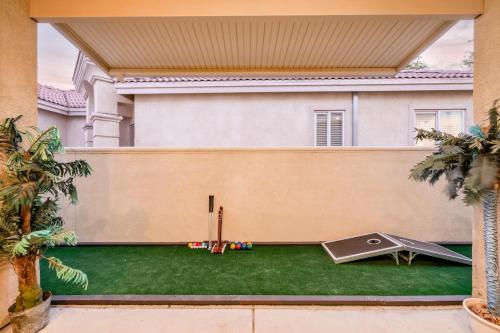 a backyard with a ping pong table at Music Lovers Paradise 7 Bed Pool Home and Game Room in Indio