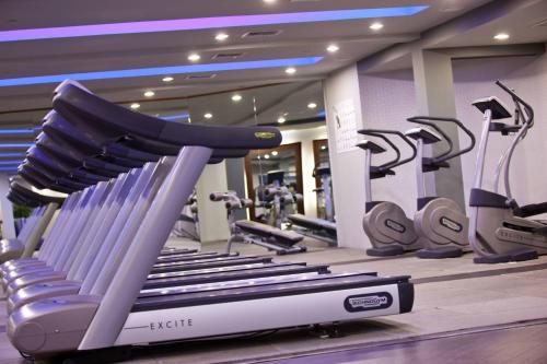a gym with a treadmill and tread machines at Renaissance Wind Creek Aruba Resort in Oranjestad