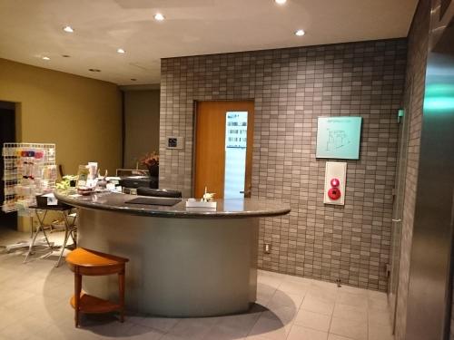 a lobby with a counter in a building at Hotel Lakeland Hikone in Hikone