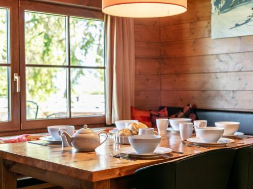 a wooden table with a tea pot on top of it at Im Brixenthal I in Wörgler Boden