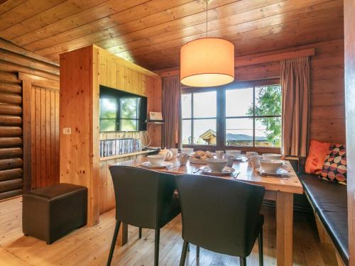 a dining room with a table and chairs at Im Brixenthal I in Wörgler Boden