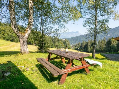 a picnic table in the grass with a candle on it at Im Brixenthal I in Wörgler Boden