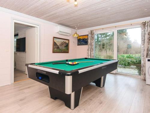 a living room with a pool table in it at 6 person holiday home in Herning in Herning