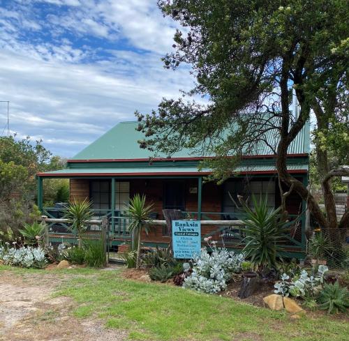 a house with a sign in front of it at Banksia Views in Sandy Point