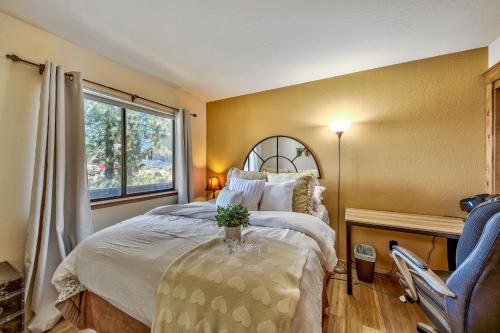 a bedroom with a large bed and a window at Mv8 lakeview across from Heavenly in Stateline