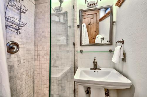 a white bathroom with a sink and a shower at Mv8 lakeview across from Heavenly in Stateline