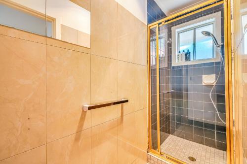 a bathroom with a shower with a glass door at StayAU Family-Friendly 3BR Getaway in Malvern in Chadstone