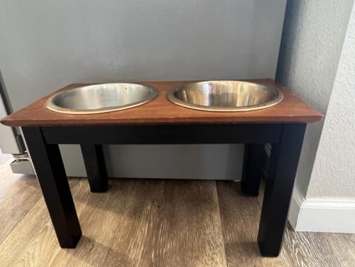 two metal bowls on top of a wooden table at Private Home - Billiards, Mountain Views, Private Desert Access, HOA Pool & Spa, BBQ, at Lambert Park - Bourbondale in Tucson