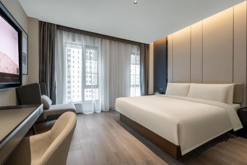 Voodi või voodid majutusasutuse Atour Hotel Changsha Middle Furong Road Tujiachong toas