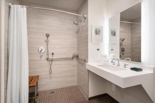 a bathroom with a sink and a shower at Aloft Mountain View in Mountain View