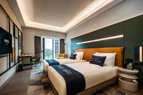 Ένα ή περισσότερα κρεβάτια σε δωμάτιο στο MUSTEL Hotel of Beijing Mentougou
