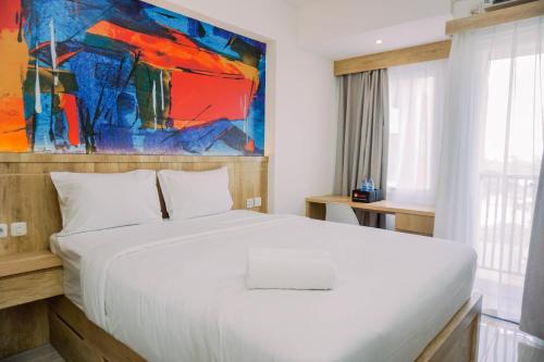 Ένα ή περισσότερα κρεβάτια σε δωμάτιο στο Modern and Nice Studio Apartment at Urban Heights Residences By Travelio