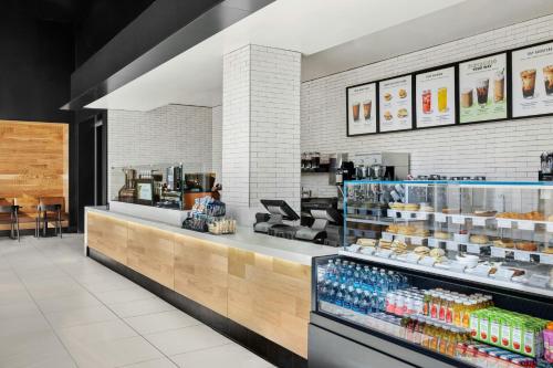 a store with a counter with drinks and food at Renaissance Boston Seaport District in Boston