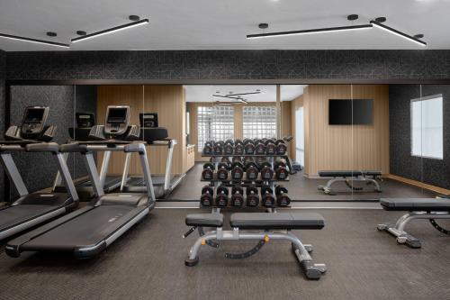 a gym with several treadmills and cardio machines at AC Hotel Park City in Park City