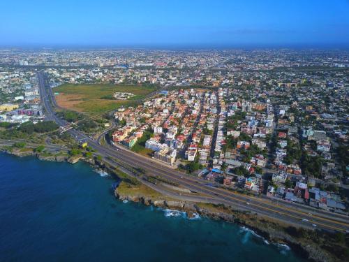 an aerial view of a city next to the water at Family 3-Bed 1 Bedroom Apartment in Corales del Sur close to the Airport in La Viva