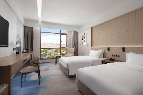 Katil atau katil-katil dalam bilik di Doubletree By Hilton Altay Fuyun
