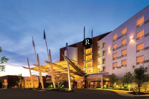 a hotel with a sign on the front of it at Renaissance Boston Patriot Place Hotel in Foxborough