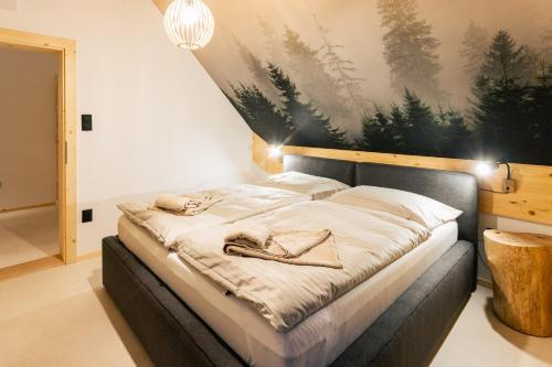 a bedroom with a bed with shoes on it at Chalet Vista with jacuzzi in Demanovska Dolina