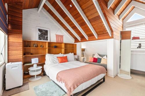 a bedroom with a large bed in a room at The Cornerstone - A Stylish Garden Terrace in Sydney