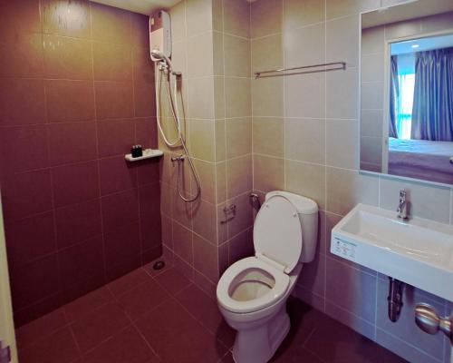 a bathroom with a toilet and a shower and a sink at A family room at Lumpini Ville Sukhumvit 101-1 by Pikul in Bangkok