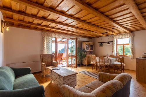 a living room with couches and a table at Balaton View From Almadi - Happy Rentals in Balatonalmádi