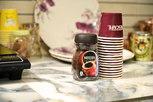 a jar of marmite sitting on a counter at vaidehi homlee premium stay, 3kms from Shri Ram janmbhoomi, Ayodhya in Faizābād
